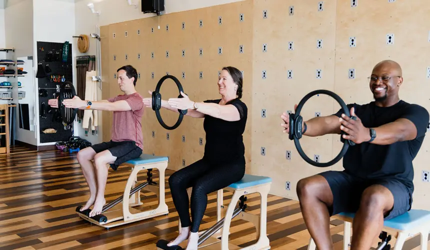 pilates-class Pilates group class using Pilates equipment