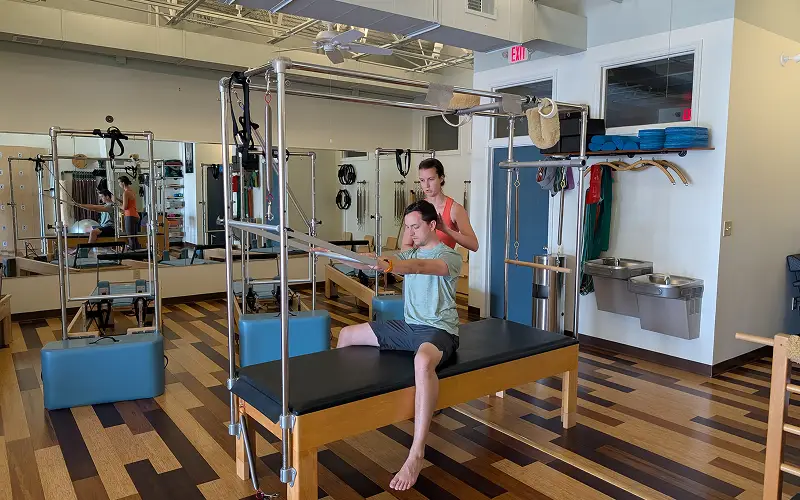 Private Pilates session at Core and Restore Pilates near Hampton Cove Huntsville Alabama with instructor guiding one on one personalized training on reformer equipment